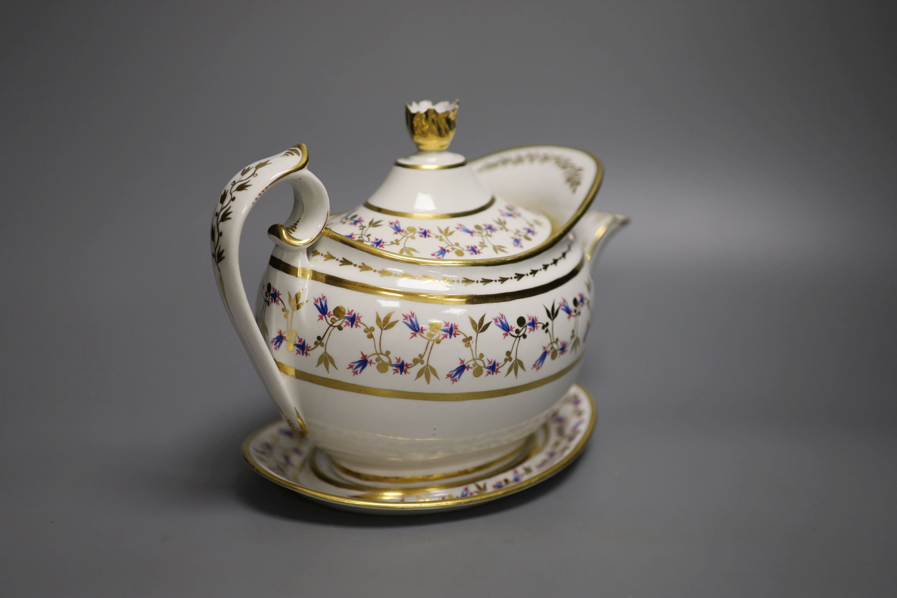 A Flight Barr and Barr teapot cover and stand, painted with cornflowers?, impressed mark to stand crown FBB, c.1825, height 18cm